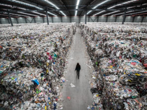 Image of Person Walking Through Plastic Waste