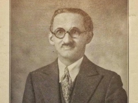 Image of a Man with a Mustache and Glasses in a Black and White Photograph