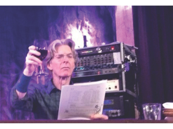 Phil Lesh raising glass at seder, credit Owen Rosenberg/J. The Jewish News of Northern California