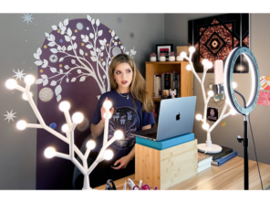 Young adult with ring lighting and computer